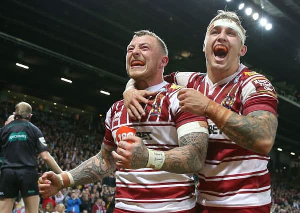 Josh Charnley celebrates his try