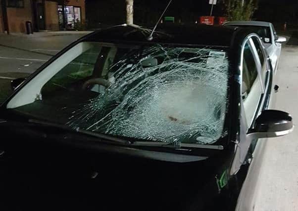 A stone thrown from a motorway bridge caused this damage to a residents car