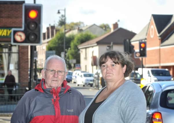 Cllrs George and Debbie Fairhurst who are complaining about the left filter at the Standish town centre crossroads after several near misses