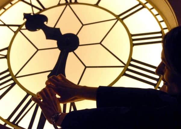 The turret clock inside the Royal Observatory in Greenwich, London being adjusted
