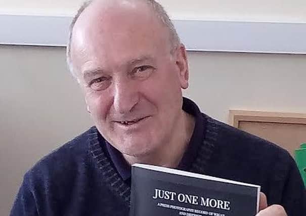 Frank Orrell with one of the news books he has produced
