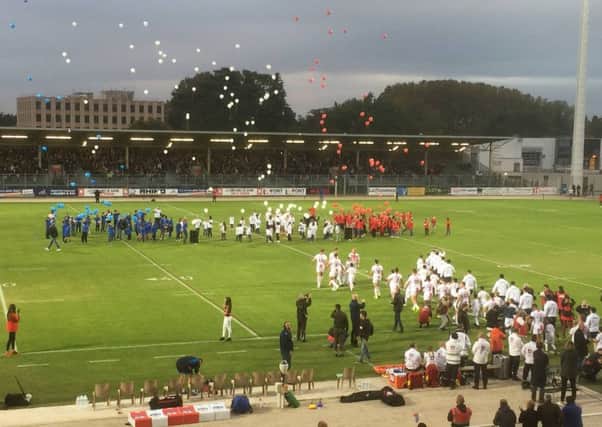 England and France walk out at Avignon's stadium on Saturday night