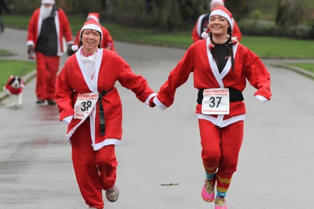 Runners in their Father Christmas suits during last years Christmas Dash