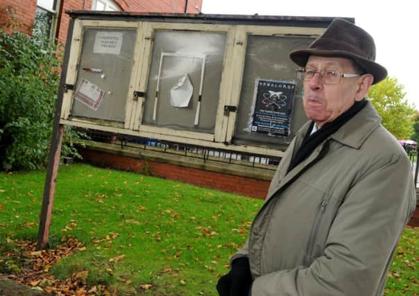 Member of Hindley Residents' Association Dave Culshaw with the old notice board next to the former Hindley Town Hall building