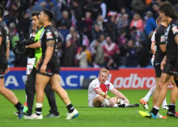 England's James Graham sits dejected at the end of his side's defeat to New Zealand