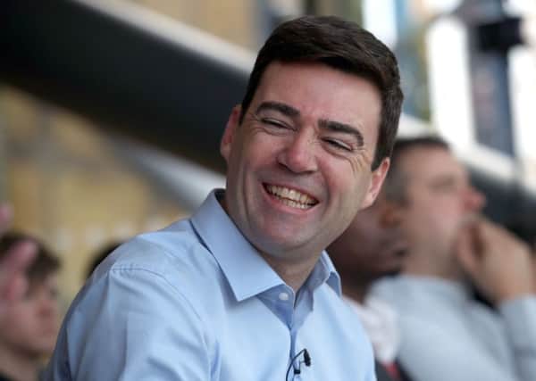 Andy Burnham arrives to speak at an event in Manchester where he launched his campaign to become Mayor of Greater Manchester