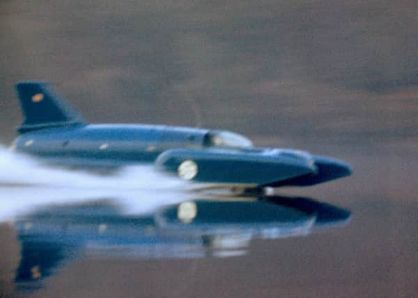 Donald Campbell on Coniston Water in his Bluebird K7