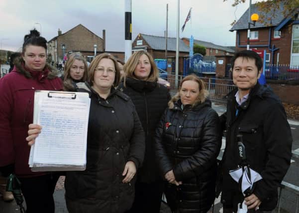Parents of pupils who attend Newfold Primary School, St James Road, Orrell with their petition