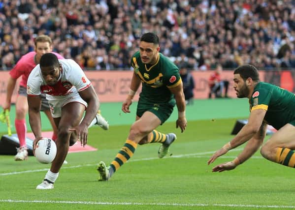 England's Jermaine McGillvary scores the opening try of the game against Australia during the Four Nations match at London Stadium