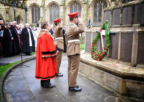 Mayor Councillor Ron Conway lays a wreath at Wigan Parish Church