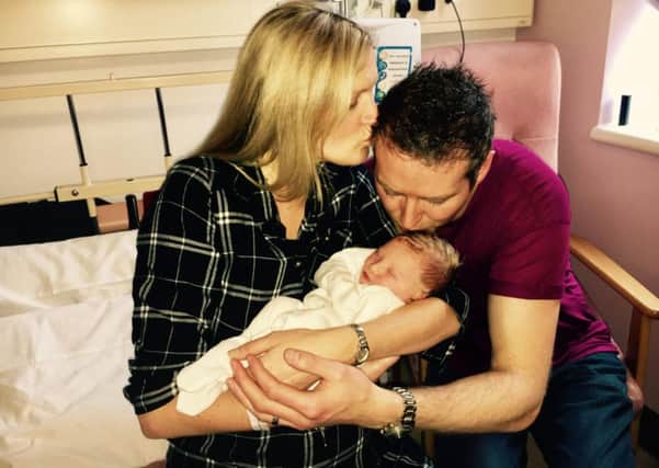 Wayne with his wife Louise and baby Jake