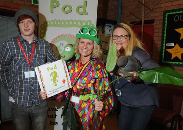 Children's author Lucia Davies, centre, visits pupils at Aspull Church Primary School as part of anti-bullying week, pictured with volunteer Kane McKiown, left, and Ruth Atherton who works for Cheshire Police