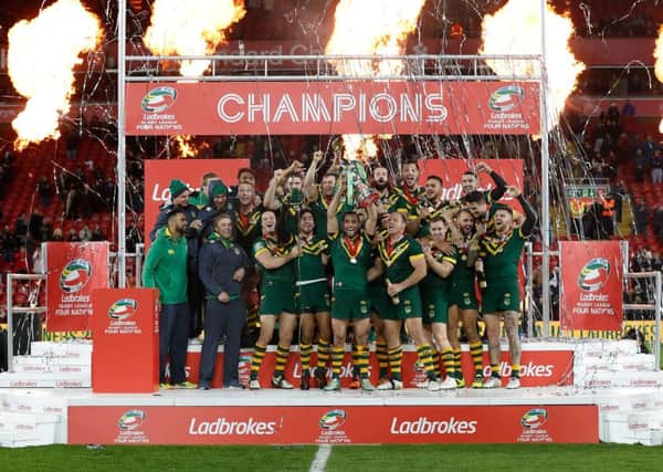 Australia's Cameron Smith (centre) lifts the trophy with his team-mates after the Four Nations Final