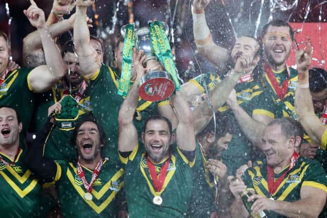 Australia captain Cameron Smith lifts the Four Nations trophy
