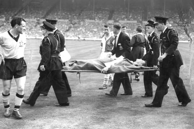 Dave Whelan being stretchered off at Wembley after breaking his leg in the 1960 FA Cup Final playing for Blackburn Rovers