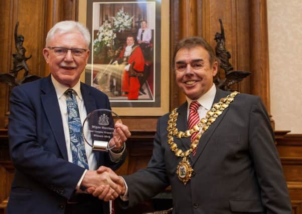 Warriors chairman Ian Lenagan collects his award from Mayor of Wigan, coun Ron Conway