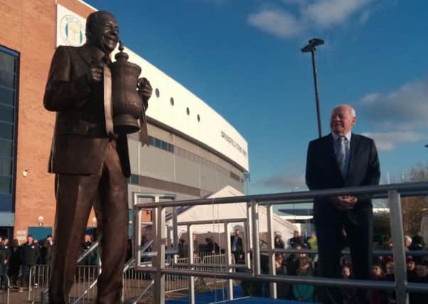 Dave Whelan and his statue outside the DW Stadium