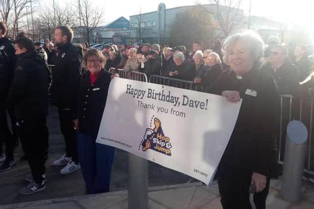 A sign for Dave Whelan on his birthday at the statue unveiling
