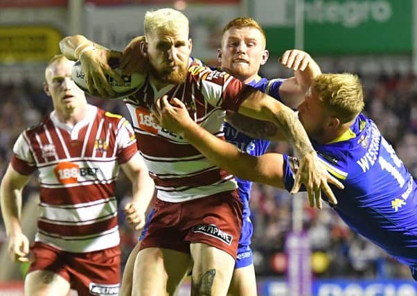 Sam Tomkins in action against Warrington before he suffered a foot injury, which required surgery