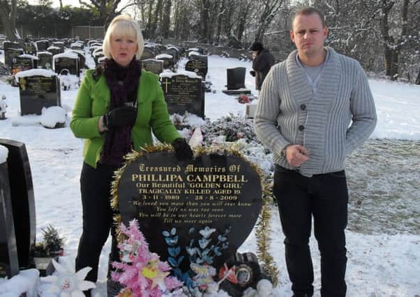 Phillipa Campbell's mum Sue and brother Lee at her grave