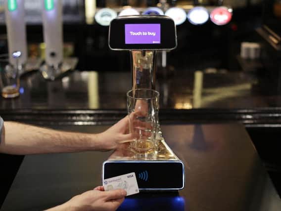 A demonstration takes place of the world's first contactless, self-serving beer pump