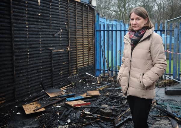 Headteacher Monica Middlehurst surveys the damage at RL Hughes Primary School