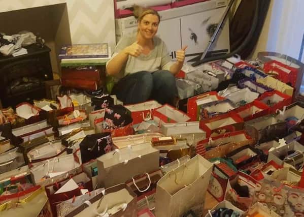 Kathryn Leyden with some of the 135 gift bags she has collected donations for and sorted for lonely people in the borough