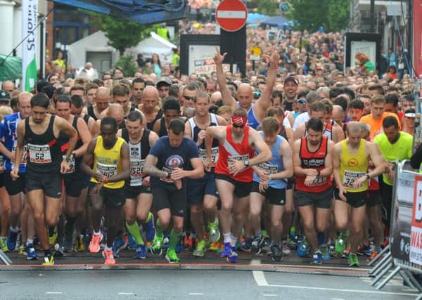 Action from the fourth annual Wigan 10K, supporters lined the streets to support runners on the course around Wigan