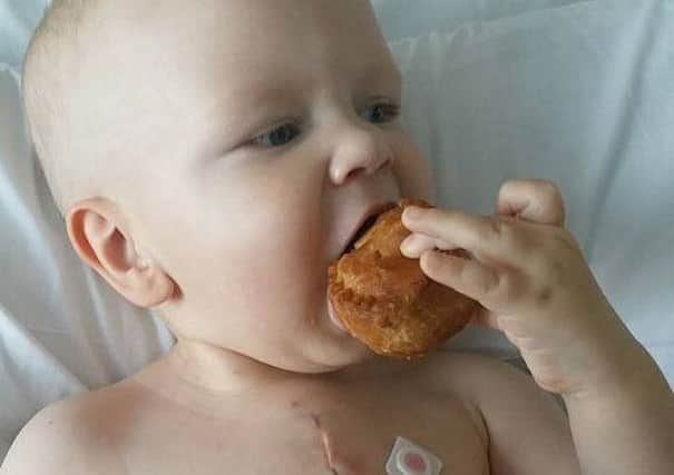 Wiganer Bobby Baldwin eating a pie, just six days after open heart surgery