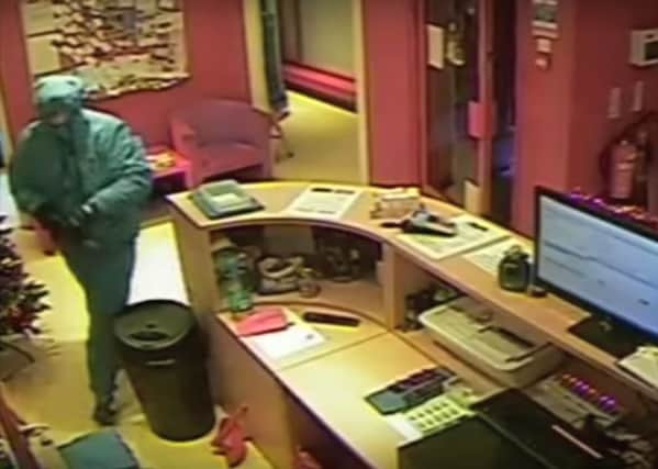 The armed robber caught on the shop's CCTV