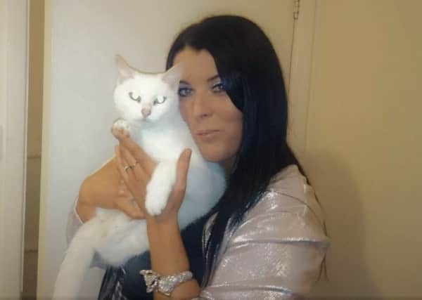 Mandy Lowe with beloved cat Coco. Mandy has started a petition to make councils scan dead pets for microchips