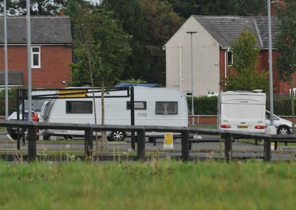 Travellers with caravans on a car park near to Leigh Sports Village
