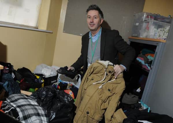 Warren Done with some of the donated clothes, at Atherton and Leigh Shelter for HoPe (homeless people)
