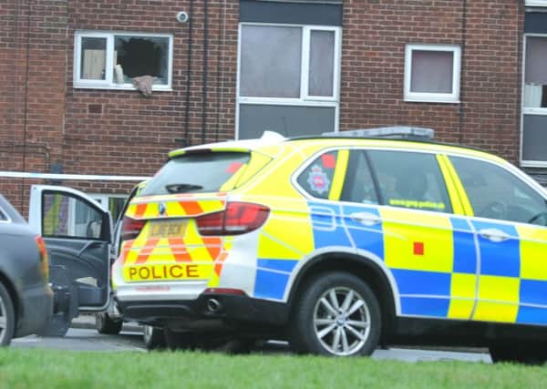 Police at the scene at Logwood Place, Newtown, Wigan, where a man barricaded himself inside a flat for over 12 hours