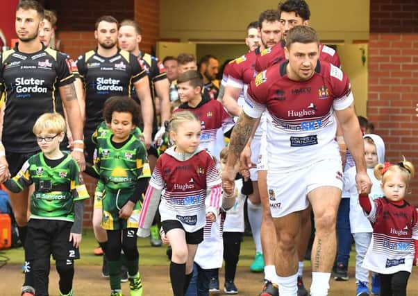 Michael McIlorum wasn't playing, but led Wigan Warriors our for his testimonial match against Leigh Centurions