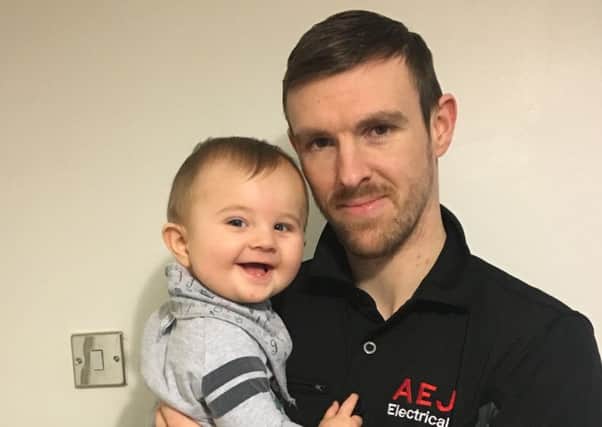 Hero electrician Andy Mather with his son Ethan