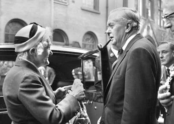 Annie Fairhurst presents Prime Minister Harold Wilson with a handbag for his wife Mary. She was hoping the gift would persuade him to rule against plans for housing near to her home