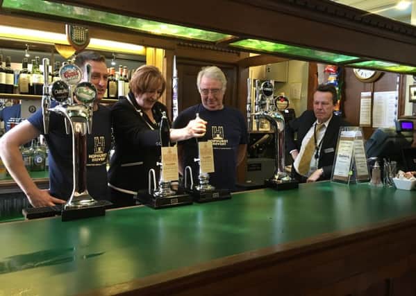 Makerfield MP Yvonne Fovargue pouring a pint of Hophurst Brewery pale ale Flaxen at the Stranger's Bar in the House of Commons