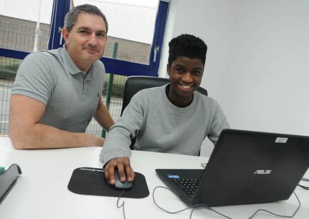 Chris Armstrong, left, with new business administration apprentice Silvester Weja