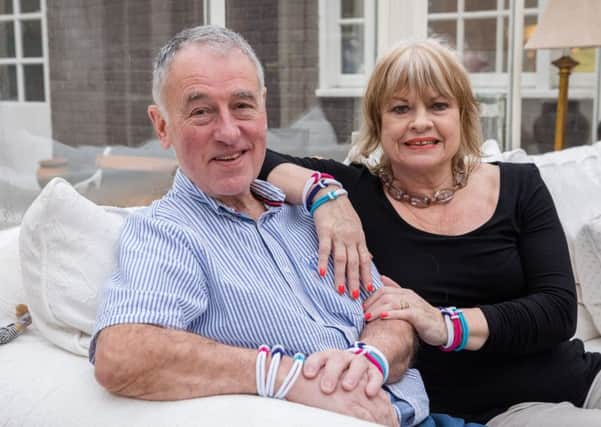 Susan and Philip Halliwell. Philip has had cancer for 11 years and is encouraging people to buy Cancer Research UKs unity bands for World Cancer Day