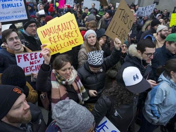 Protesters assemble at John F. Kennedy International Airport in New York