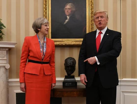 Prime Minister Theresa May meets US President Donald Trump by a bust of Sir Winston Churchill in the White House