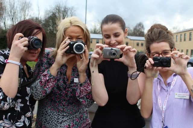 Hospice staff encouraging Wiganers to take part in the photography competition