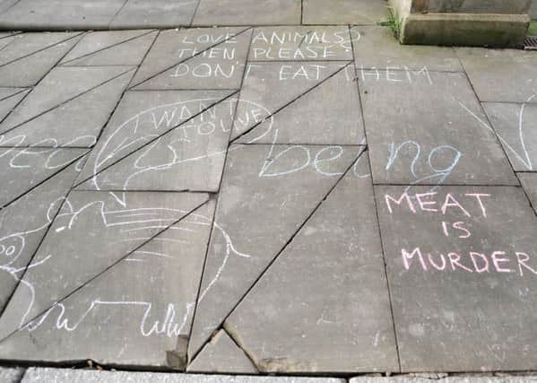 Chalk messages on the pavement - 

Wigan Vegan Advocacy group in Market Place, Wigan