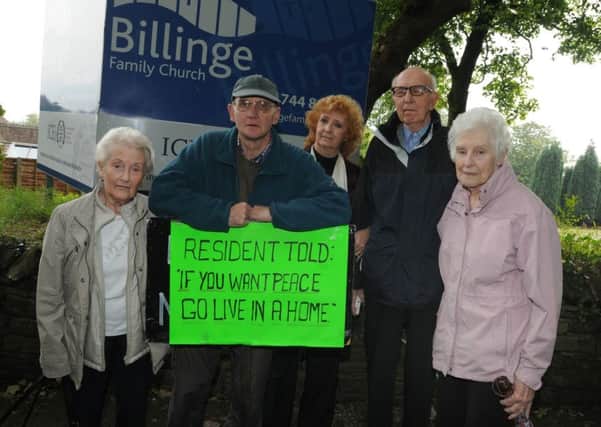 Residents pictured protesting about noise pollution and parking issues outside Billinge Family Church