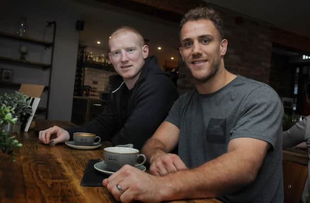 Lee Mossop and Liam Farrell catch up at the Salford player's coffee shop, The Old Bank