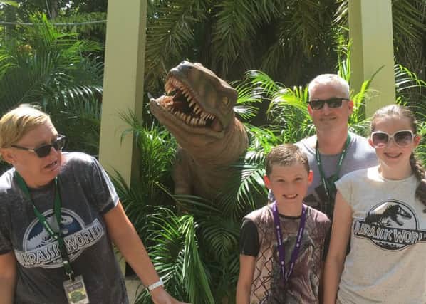 The winning photo of Vicki Loftus and her family  shot at the Raptor Experience at Universal Studios, Florida