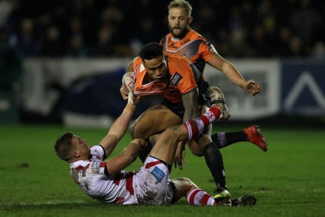 Castleford Tigers' Ben Roberts is brought down during the Super League match at the Mend-A-Hose Jungle, Castleford