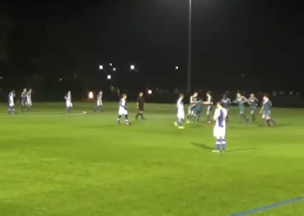 The young Latics celebrate the incredible strike