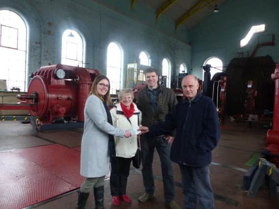 Pat, Alan and Sarah Farnworth present a cheque for 500 to secretary of Red Rose Steam Society Mike Shardlow